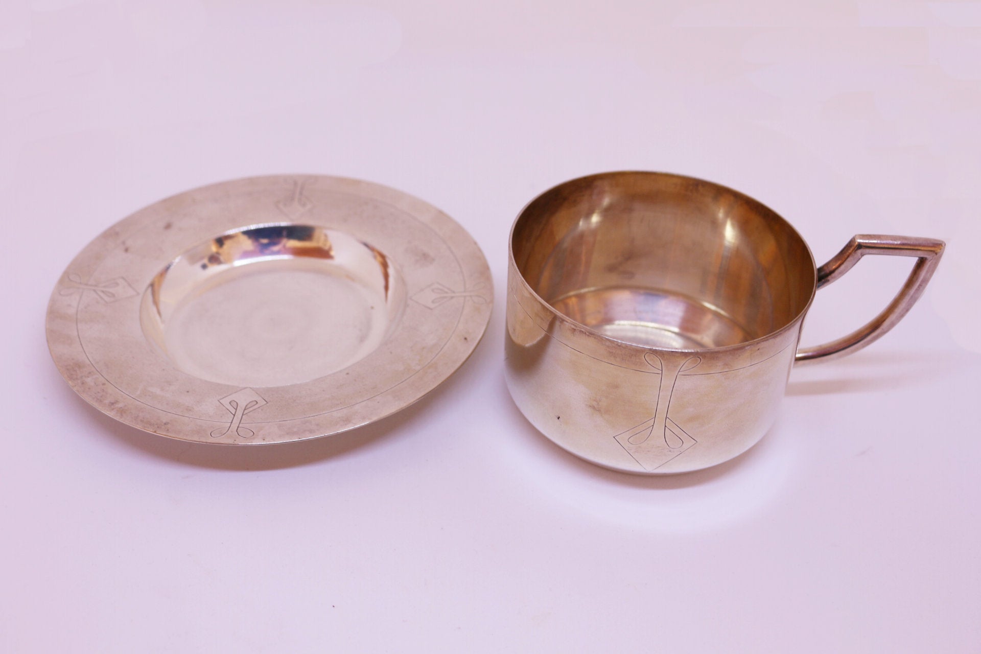 Taza y Plato elaborado en Plata Meneses
